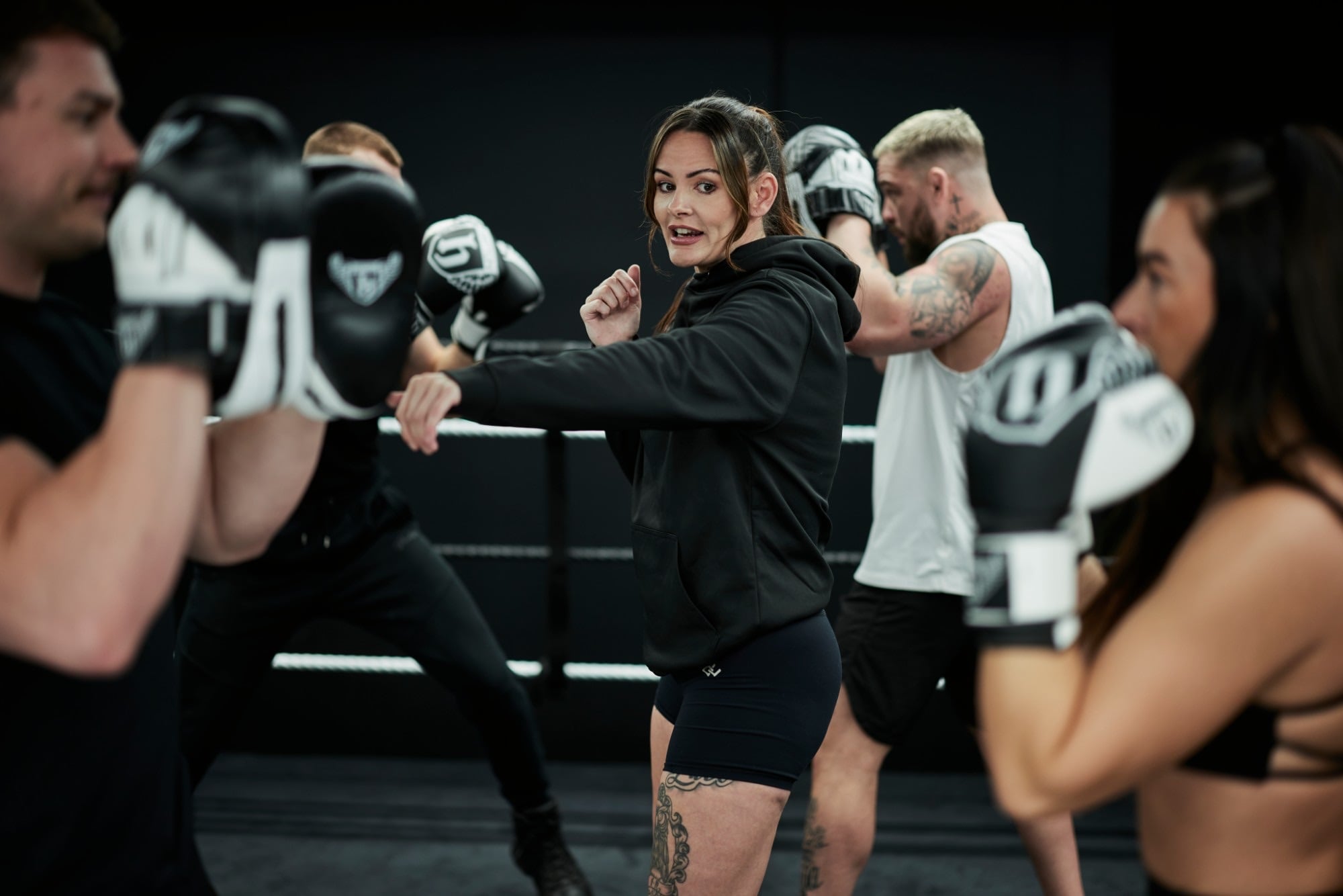 Hatton Boxing instructor demonstrating a punch to a padwork class in the ring