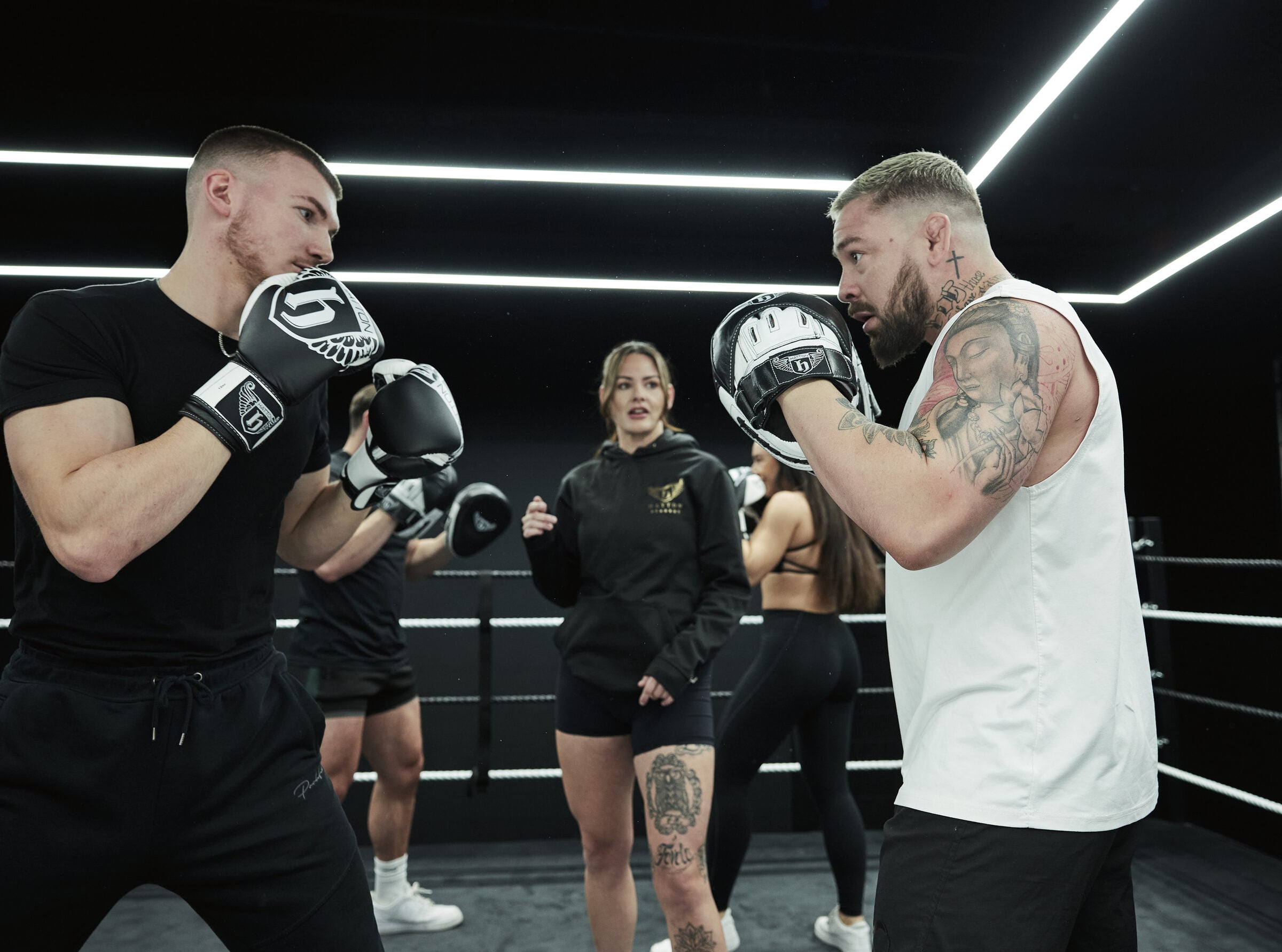 Hatton Boxing Master Trainer coaching in the ring while a group looks on